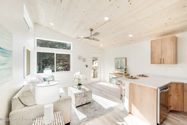 a kitchen with a microwave stove top oven and sink