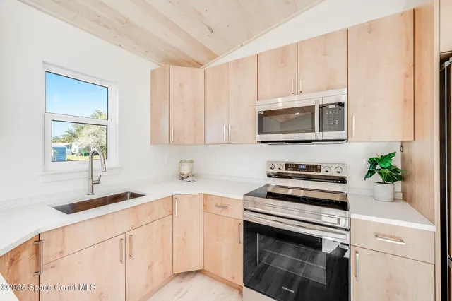 a living room with furniture and large window