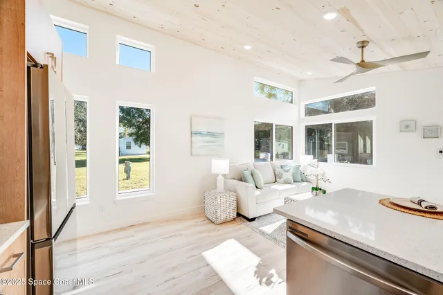 a kitchen with stainless steel appliances a refrigerator sink and cabinets
