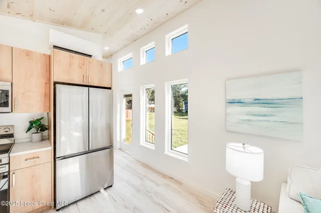 a view of a living room with entryway