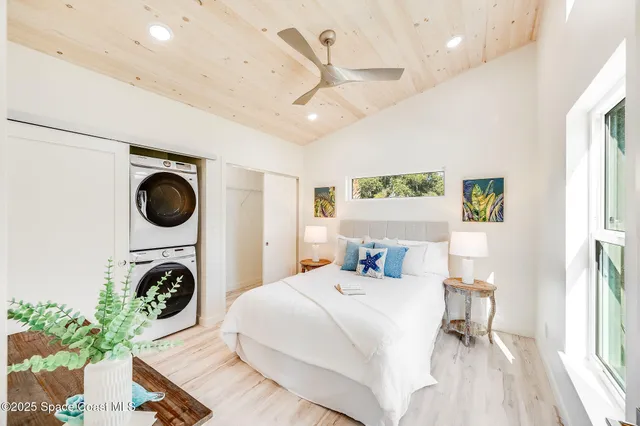 a spacious bedroom with a bed and furniture