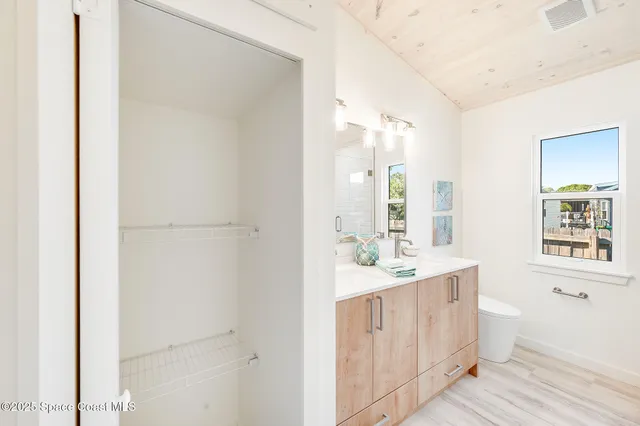 a house with palm tree in front of it