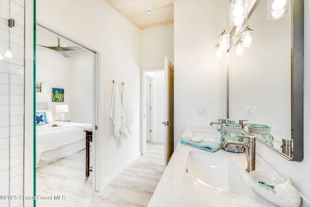 a view of a house with backyard and trees