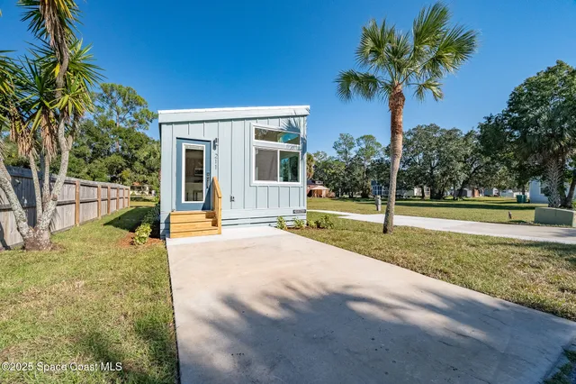 a swimming pool with outdoor seating and yard