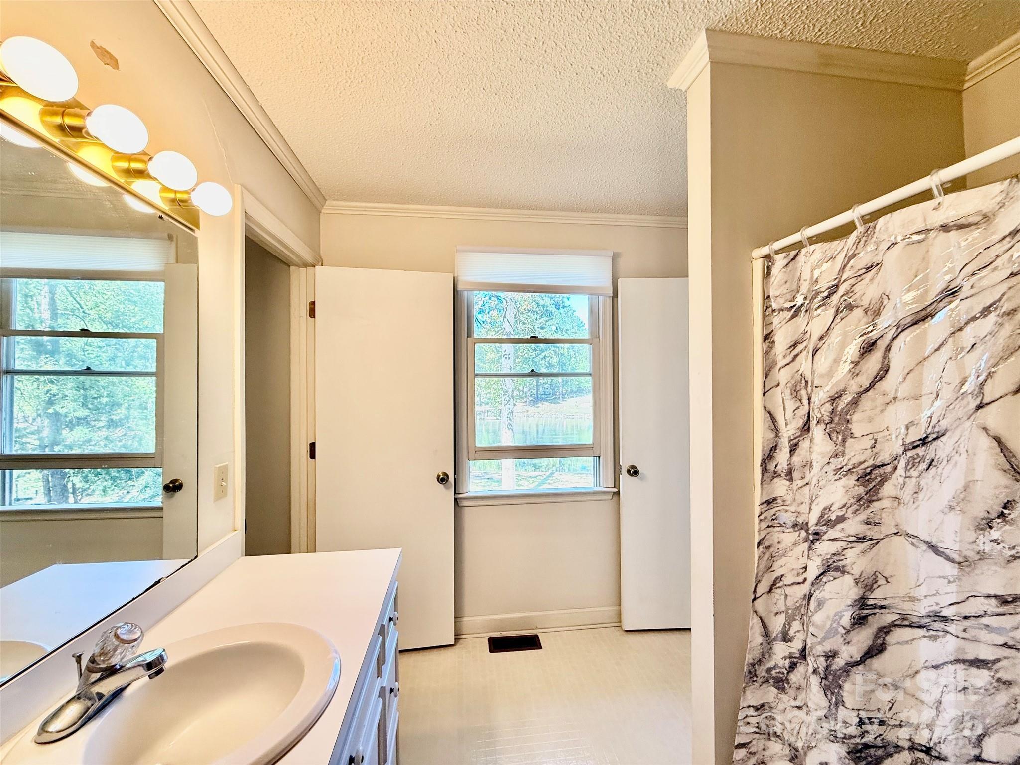 2178 Duck Cove Road Camden, SC 29020 - Photo 21 of 38 a bathroom with a sink and a mirror