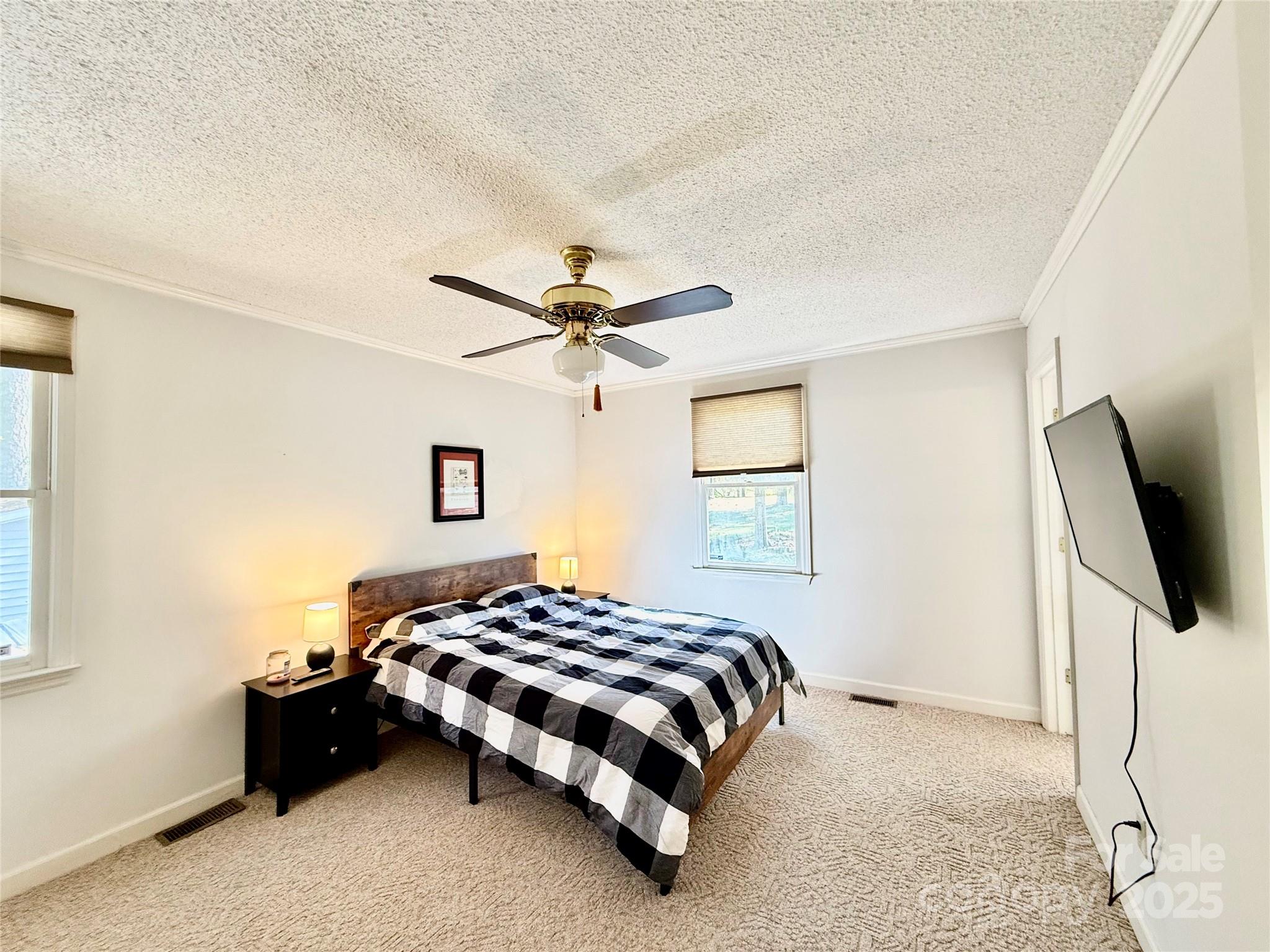 2178 Duck Cove Road Camden, SC 29020 - Photo 22 of 38 a bedroom with a bed and flat screen tv