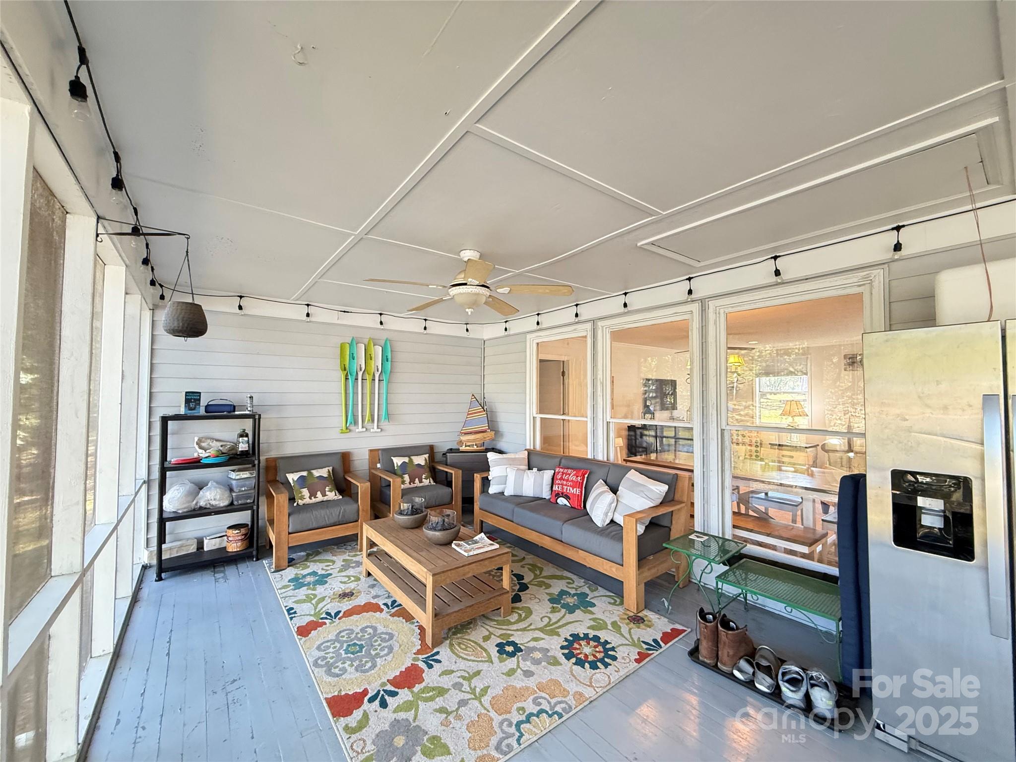 2178 Duck Cove Road Camden, SC 29020 - Photo 26 of 38 a living room with lots of furniture and a floor to ceiling window