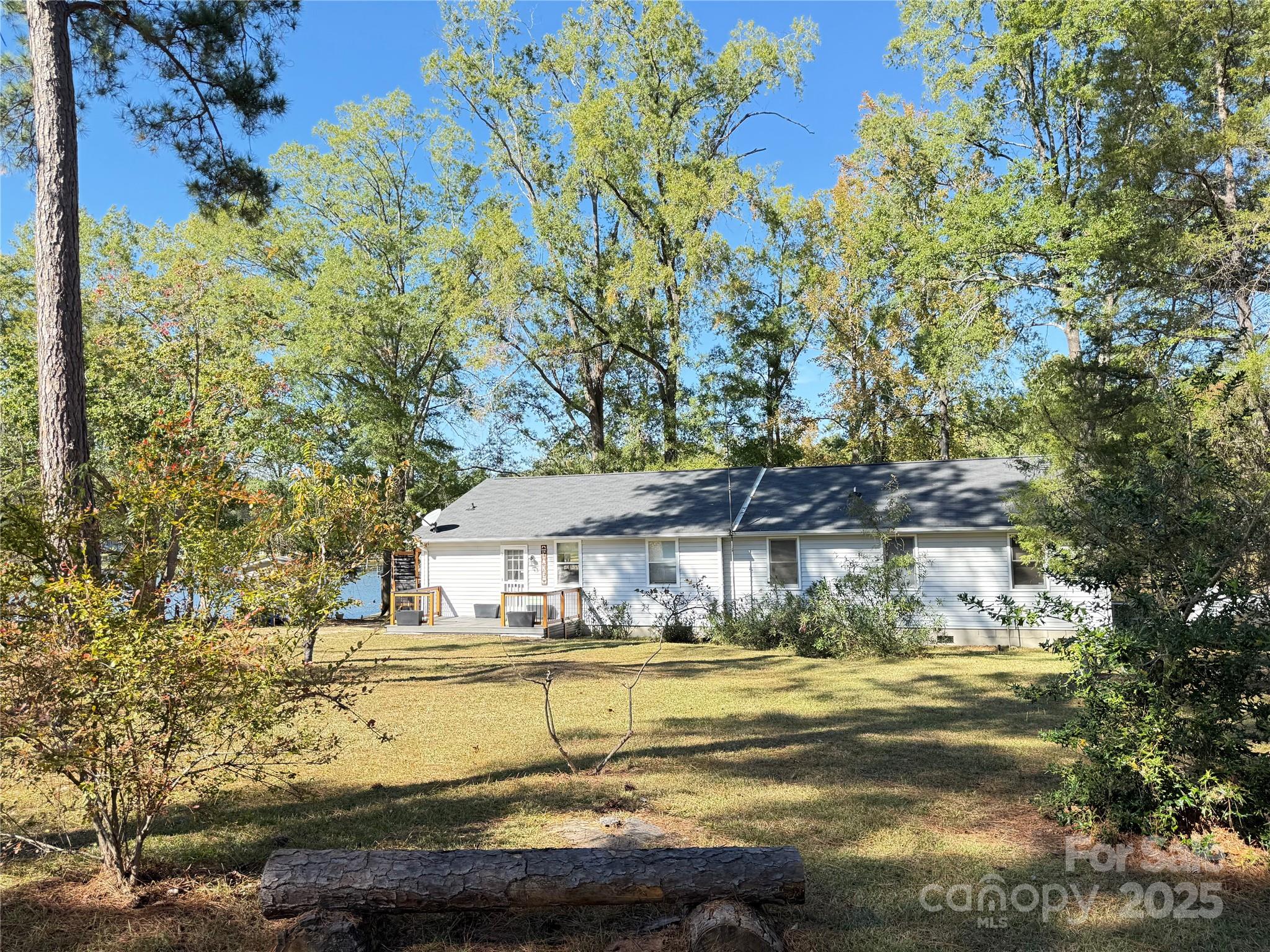 2178 Duck Cove Road Camden, SC 29020 - Photo 31 of 38 a view of swimming pool with outdoor seating and house in the background