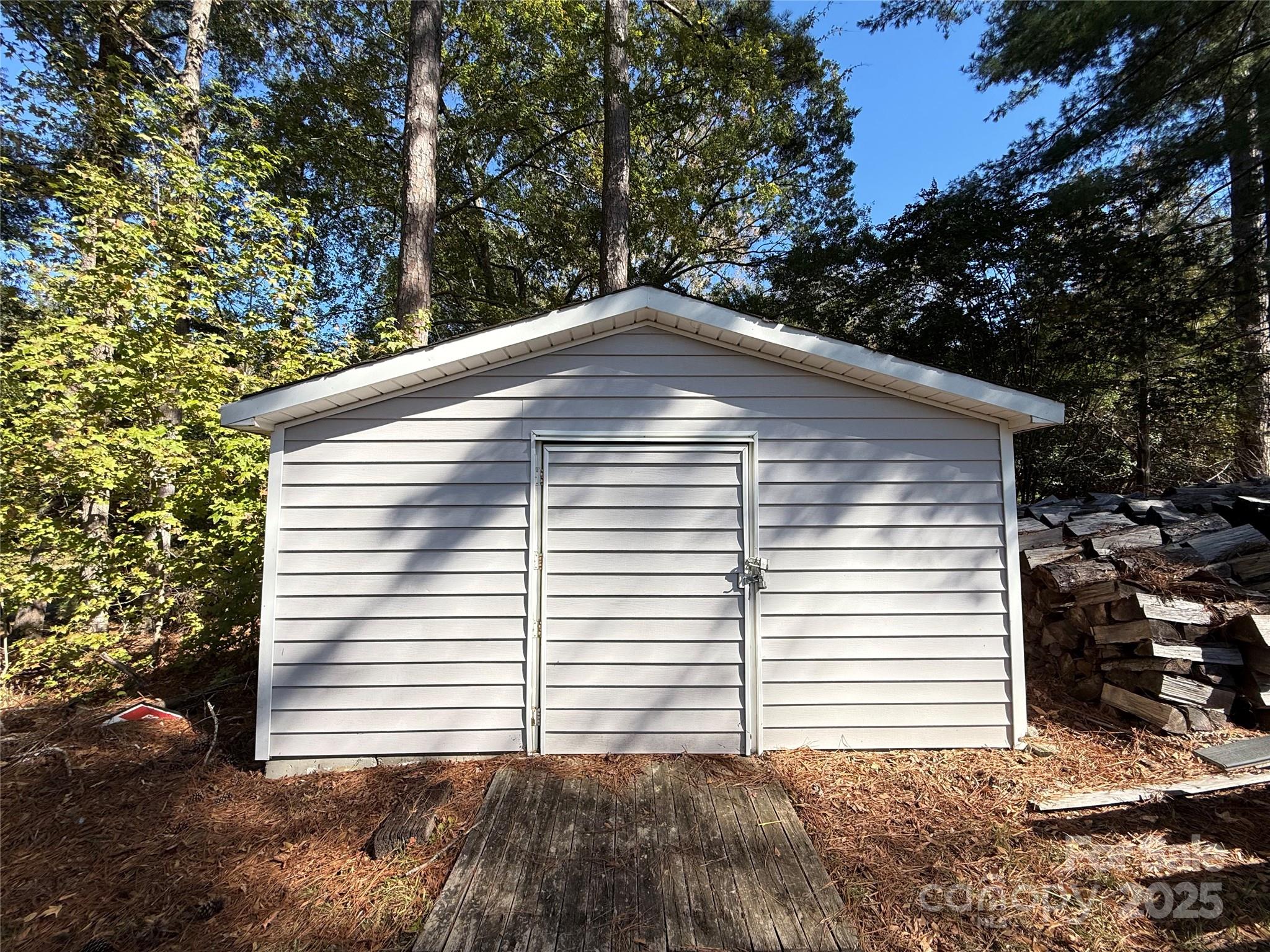 2178 Duck Cove Road Camden, SC 29020 - Photo 38 of 38 a blue white house sitting next to a tree