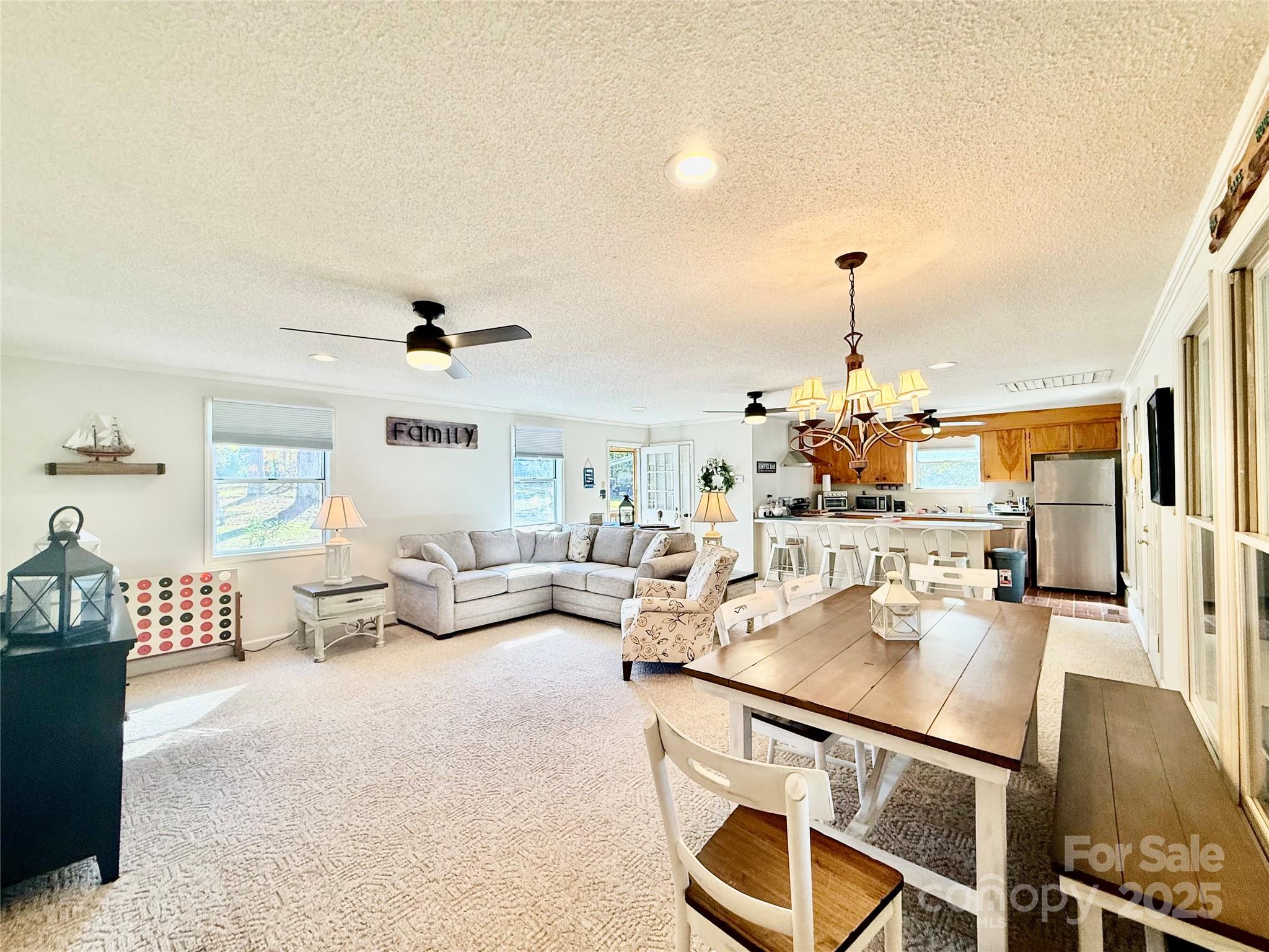2178 Duck Cove Road Camden, SC 29020 - Photo 5 of 38 a living room with furniture and a chandelier