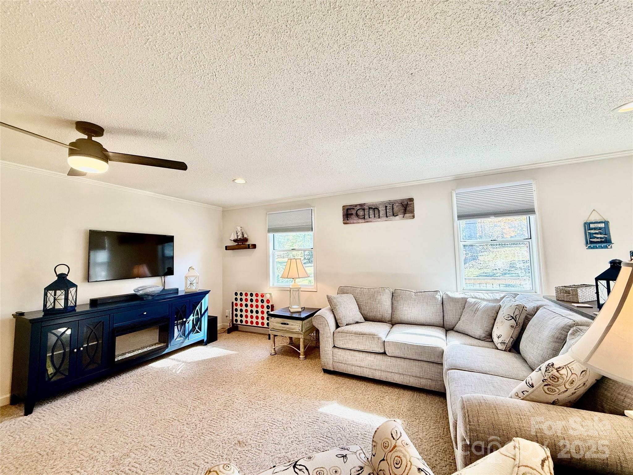 2178 Duck Cove Road Camden, SC 29020 - Photo 6 of 38 a living room with furniture and a flat screen tv