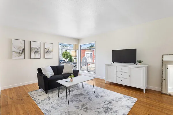 a living room with furniture and a flat screen tv