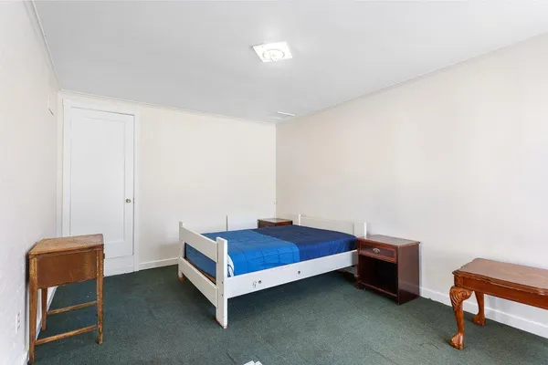 a room with a bed and a chair