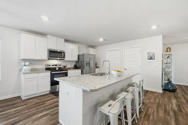 a spacious bathroom with a double vanity sink a window and a mirror