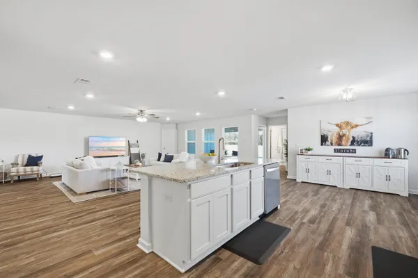 a spacious bedroom with a bed and a window