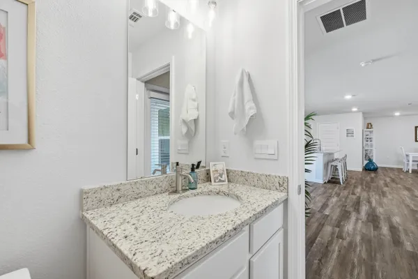 a kitchen with a refrigerator and cabinets