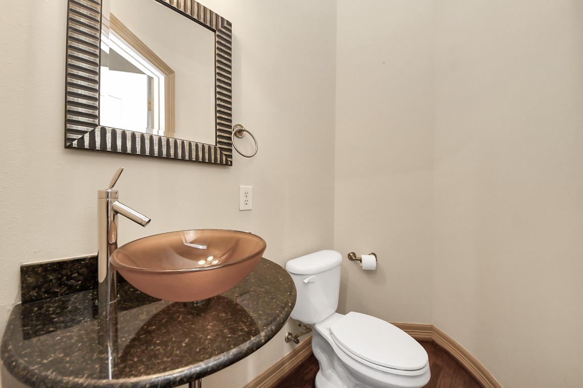 5711 Kiam Street Houston, TX 77007 - Photo 15 of 30 a white toilet sitting next to a shower
