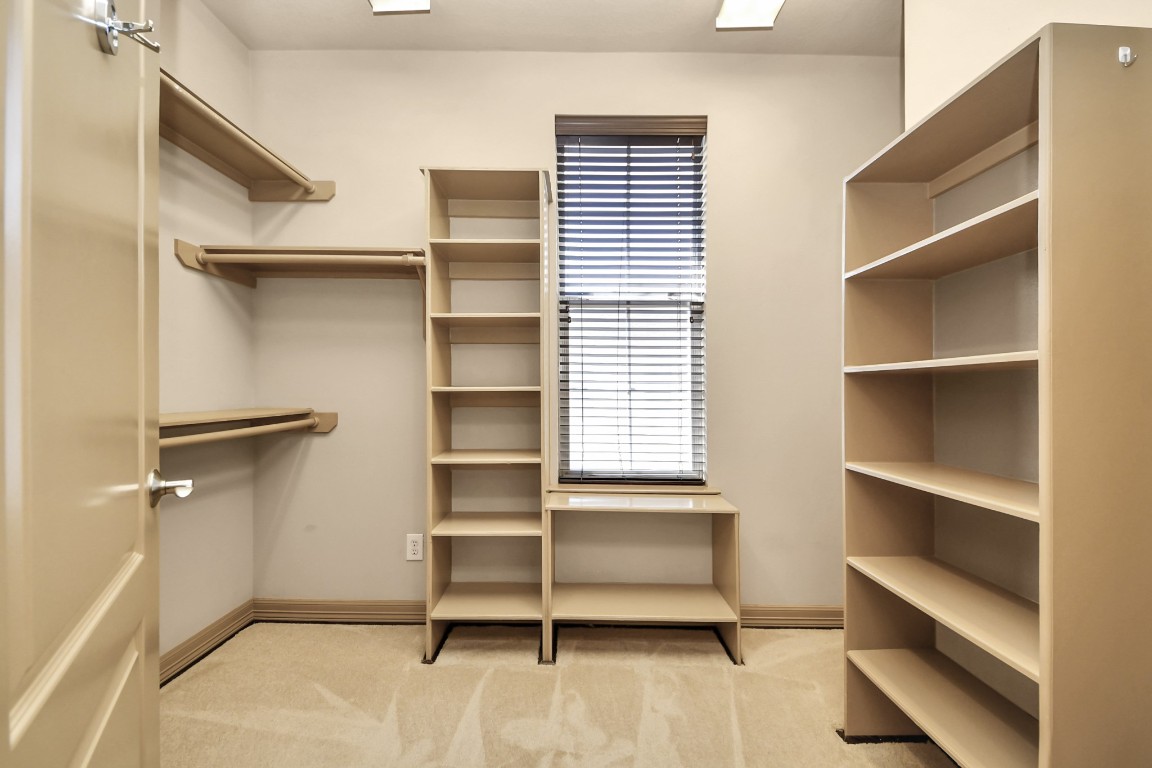5711 Kiam Street Houston, TX 77007 - Photo 26 of 30 a view of walk in closet with empty racks