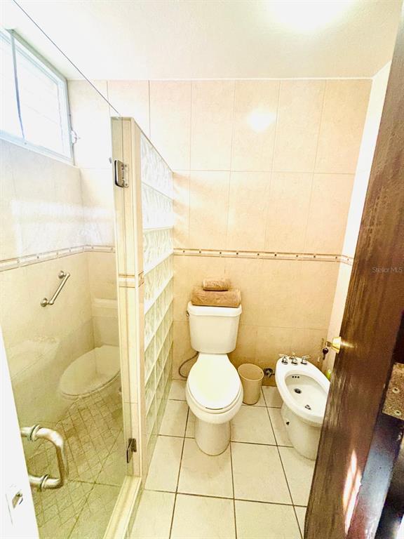 1 St Rio Grande, Unit B6 Rio Grande, PR 00745 - Photo 27 of 47 a bathroom with a toilet sink and shower