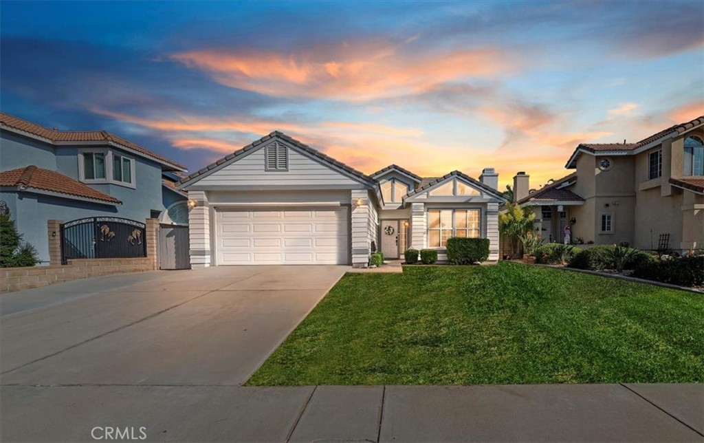 19966 Westerly Drive Riverside, CA 92508 - Photo 1 of 39 a front view of a house with a garden and pathway