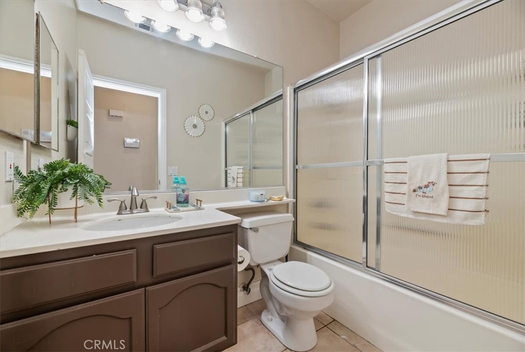 19966 Westerly Drive Riverside, CA 92508 - Photo 19 of 39 a bathroom with a sink a toilet and shower