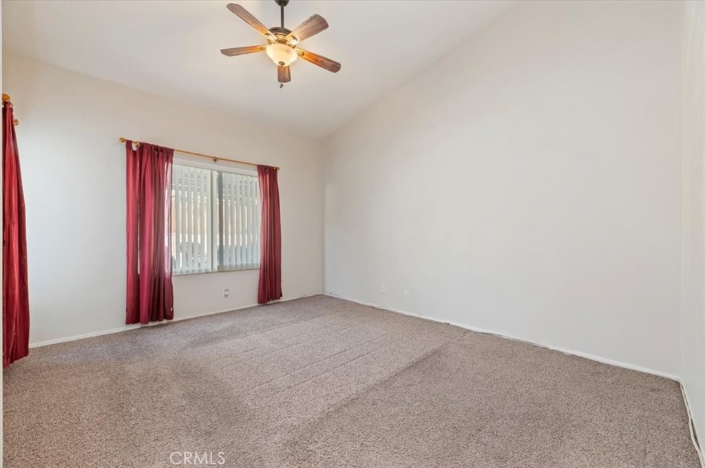 19966 Westerly Drive Riverside, CA 92508 - Photo 28 of 39 a view of a room with a ceiling fan and a window