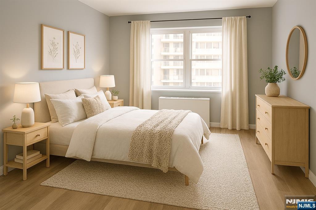 280 South Prospect Avenue, Unit 3N Hackensack, NJ 07601 - Photo 11 of 24 a bedroom with a bed a mirror and a window