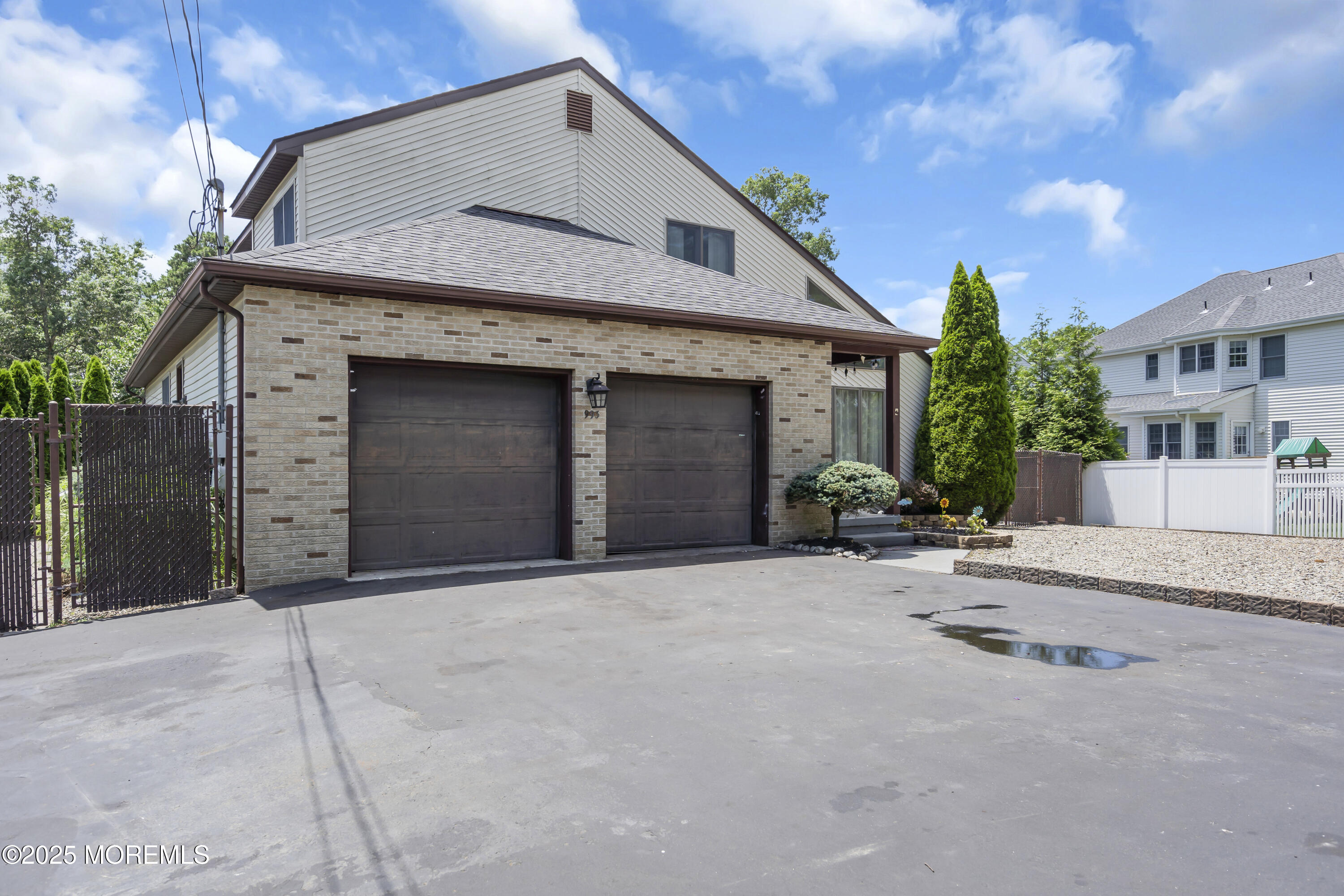 993 Sandy Circle Manahawkin, NJ 08050 - Photo 2 of 43 a front view of a house with yard