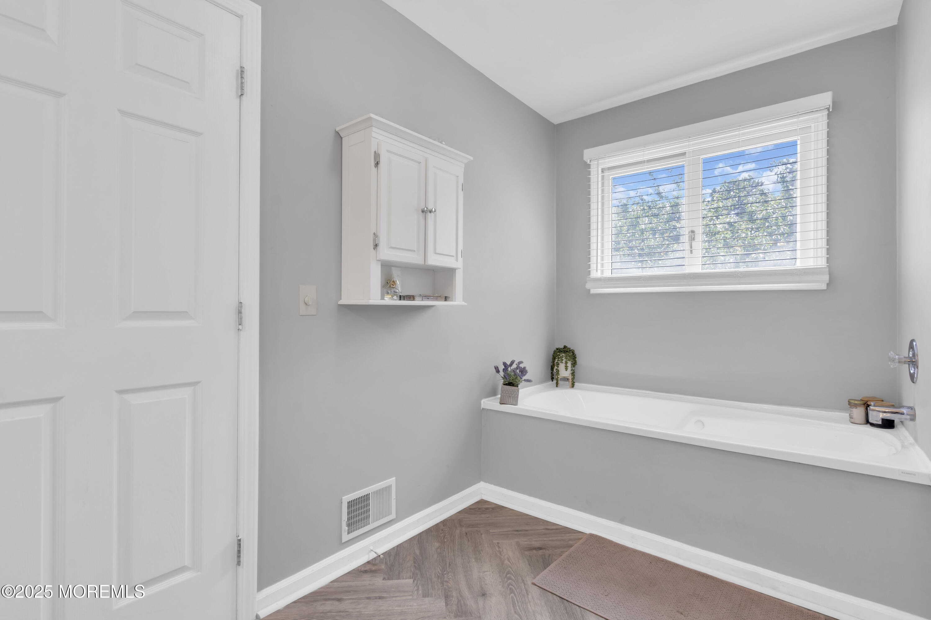 993 Sandy Circle Manahawkin, NJ 08050 - Photo 30 of 43 a bathroom with a bathtub and sink