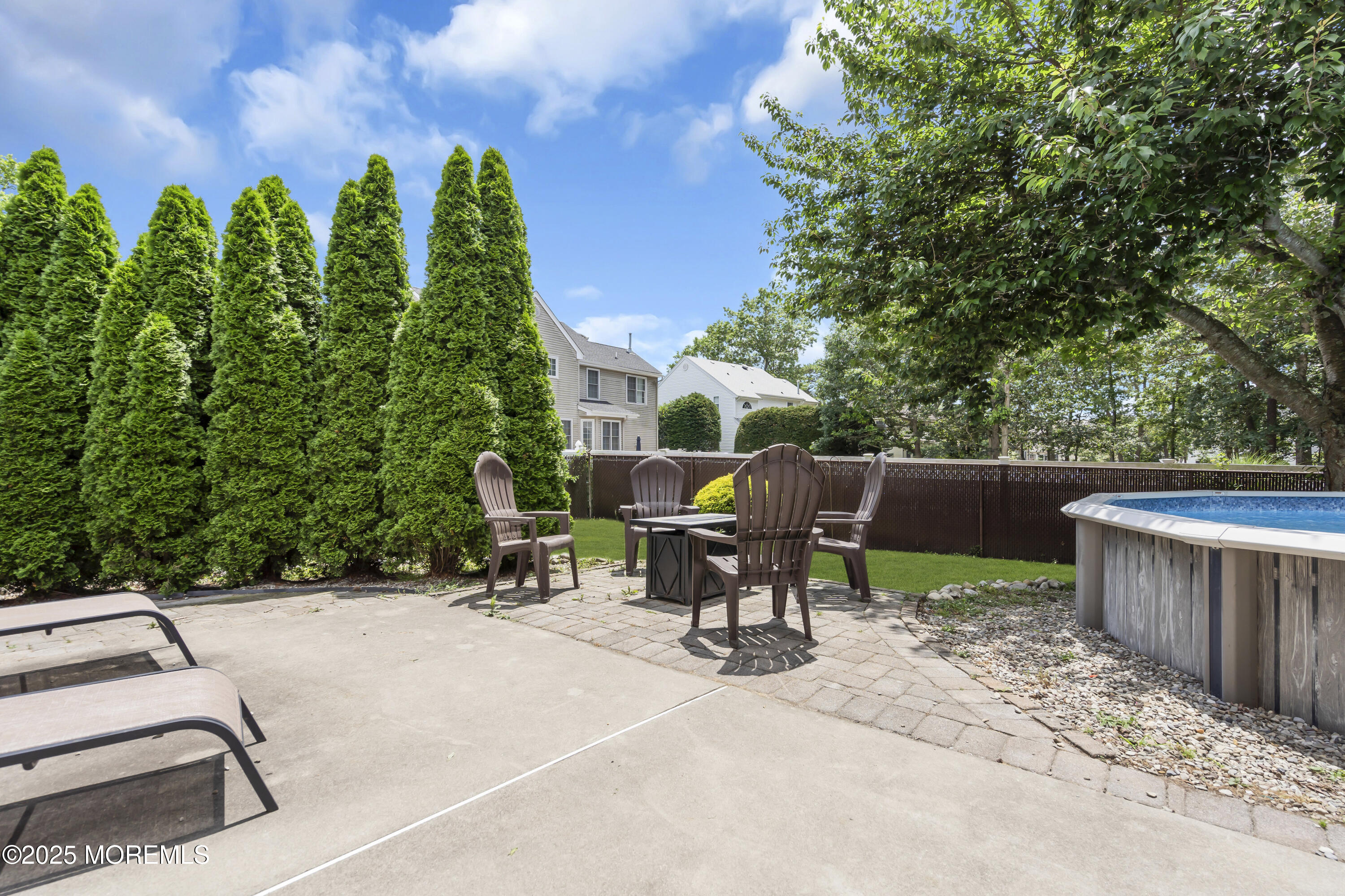 993 Sandy Circle Manahawkin, NJ 08050 - Photo 40 of 43 a view of a patio with a table and chairs