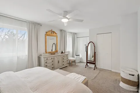 a bedroom with a bed and a dresser