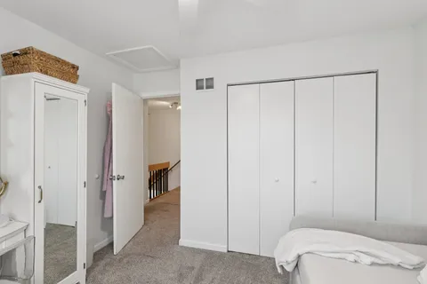 a view of a bedroom with closet