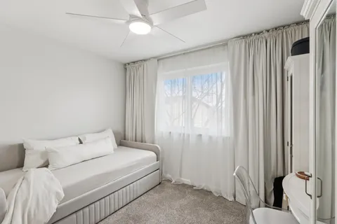 a room with a bed and a window