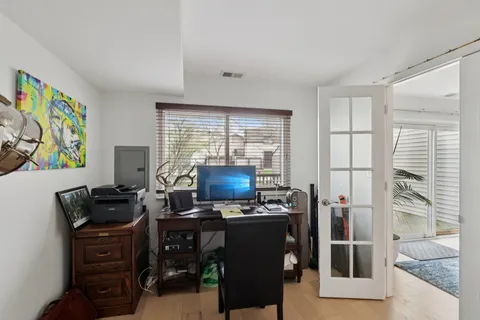 a workspace with furniture and a window