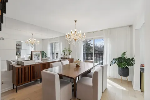 a dining room with a table and chairs