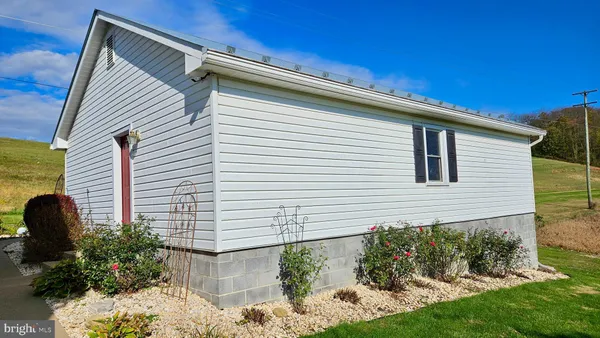 a aerial view of a house with a yard and a swimming pool