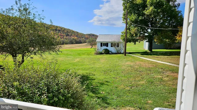 a view of a closet area with wooden floor