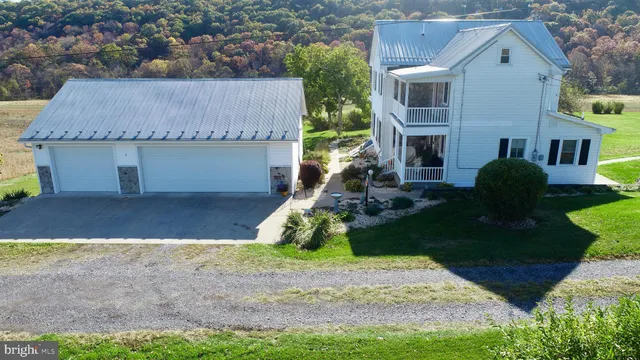 a view of outdoor space with wooden floor and a window