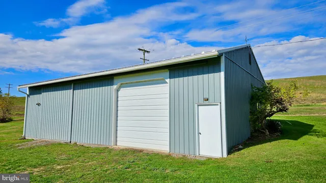 a view of a backyard with a fountain