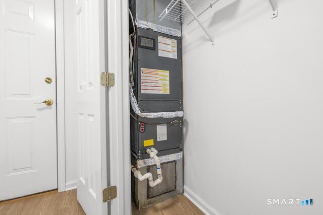 468 Main Street, Unit 318 East Lyme, CT 06357 - Photo 12 of 33 a view of walk in closet with clothes and shoes
