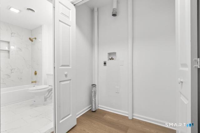 468 Main Street, Unit 318 East Lyme, CT 06357 - Photo 13 of 33 a bathroom with a sink a toilet and shower