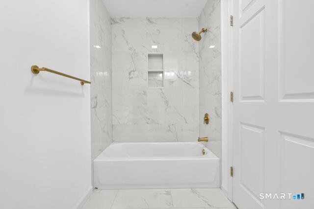 468 Main Street, Unit 318 East Lyme, CT 06357 - Photo 14 of 33 a bathroom with a bathtub and shower