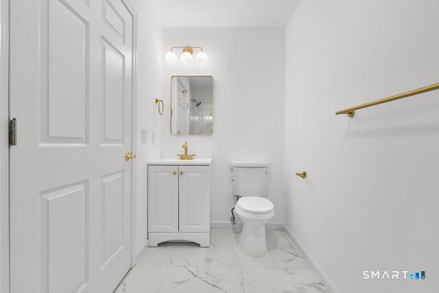 468 Main Street, Unit 318 East Lyme, CT 06357 - Photo 15 of 33 a bathroom with a sink a toilet and shower