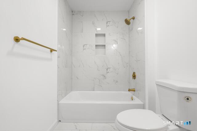 468 Main Street, Unit 318 East Lyme, CT 06357 - Photo 17 of 33 a bathroom with a toilet and a bathtub