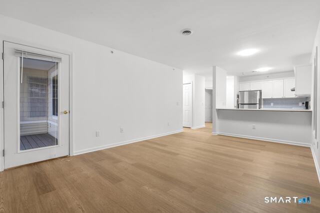 468 Main Street, Unit 318 East Lyme, CT 06357 - Photo 27 of 33 a view of a kitchen with a sink and cabinets