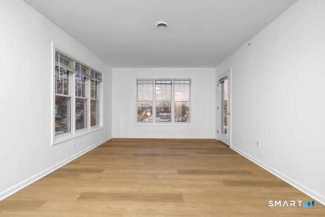 468 Main Street, Unit 318 East Lyme, CT 06357 - Photo 28 of 33 a view of an empty room with a window