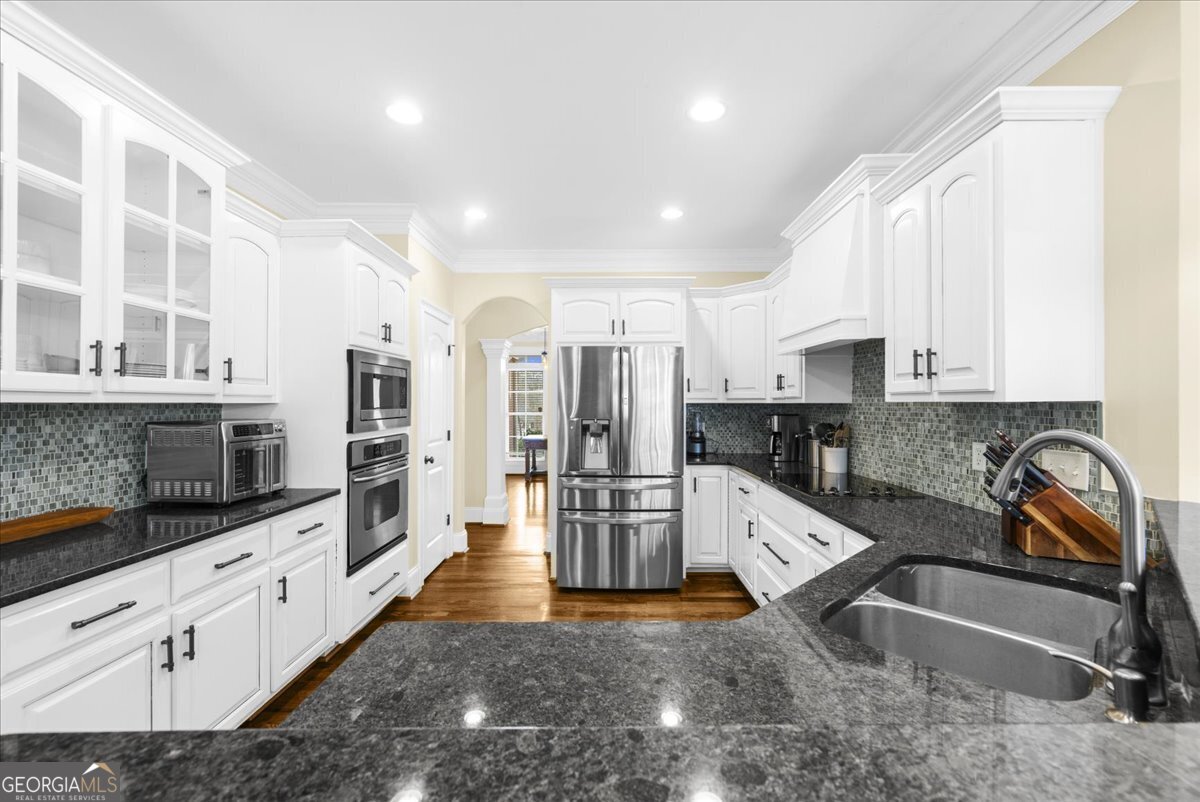 39 Fieldstone Drive Northeast Rome, GA 30161 - Photo 17 of 56 a kitchen with stainless steel appliances granite countertop a sink and cabinets