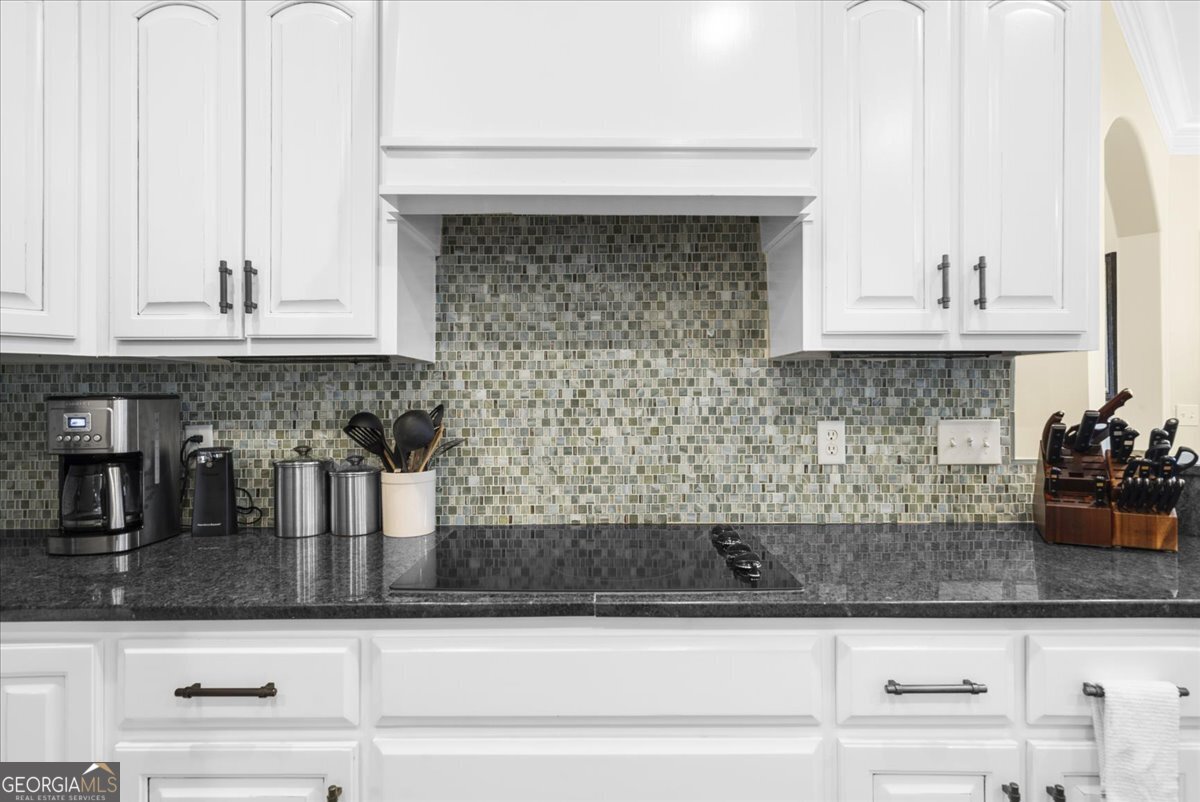 39 Fieldstone Drive Northeast Rome, GA 30161 - Photo 20 of 56 a kitchen with granite countertop white cabinets and a sink