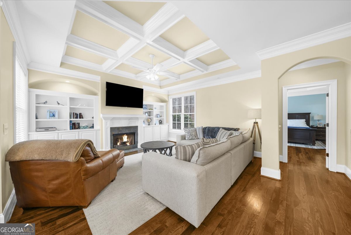 39 Fieldstone Drive Northeast Rome, GA 30161 - Photo 23 of 56 a living room with furniture a fireplace and a flat screen tv