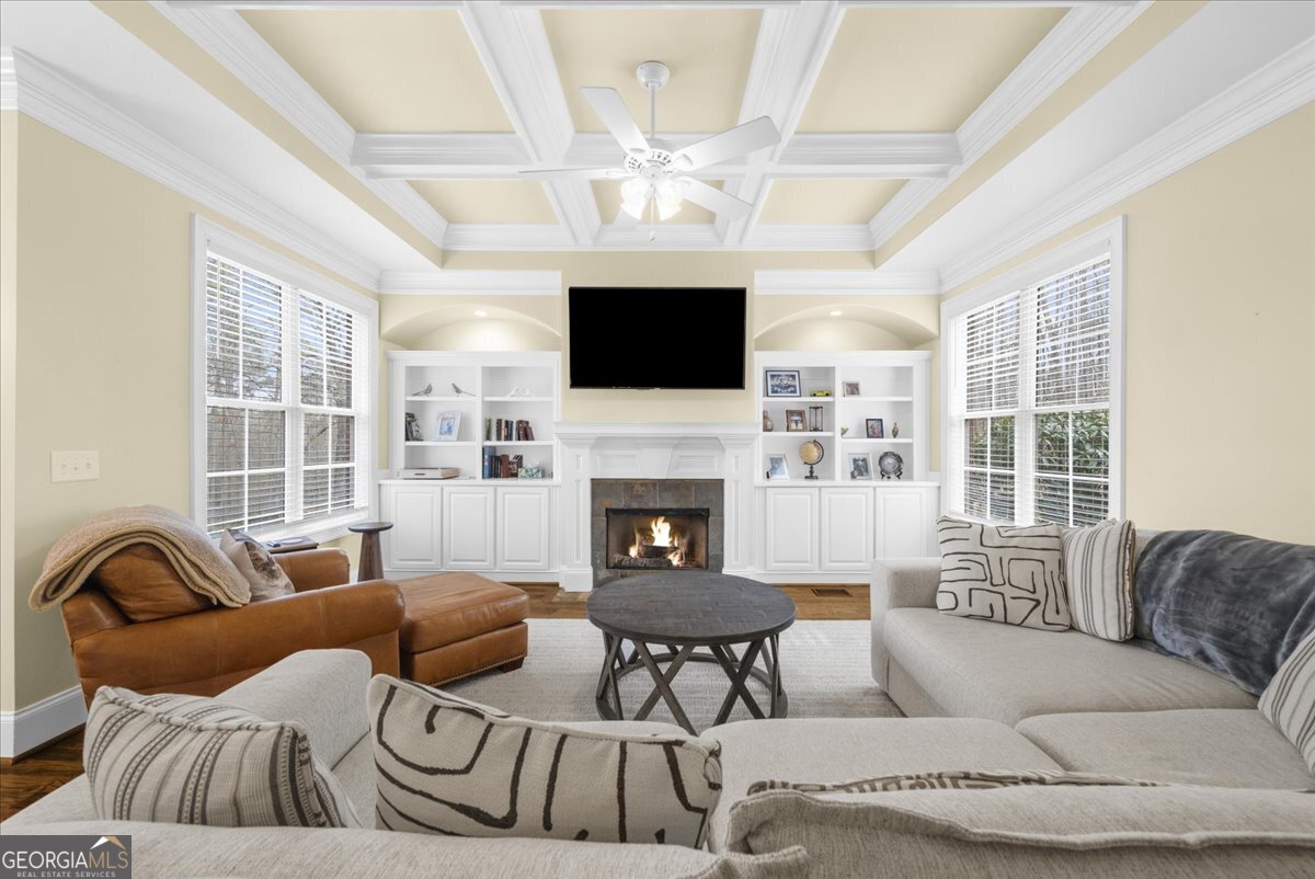 39 Fieldstone Drive Northeast Rome, GA 30161 - Photo 25 of 56 a living room with furniture a fireplace and a flat screen tv